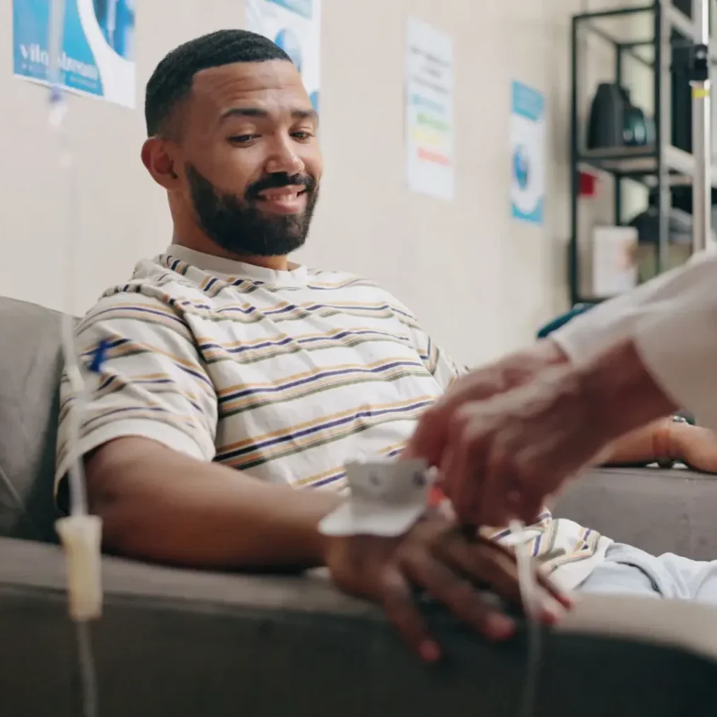A man receiving a medical injection while sitting calmly.