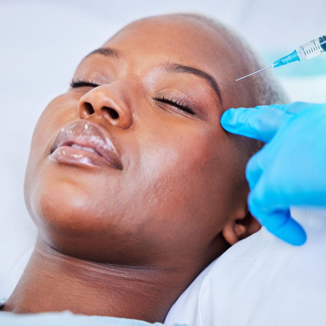 Woman receiving a cosmetic facial injection.