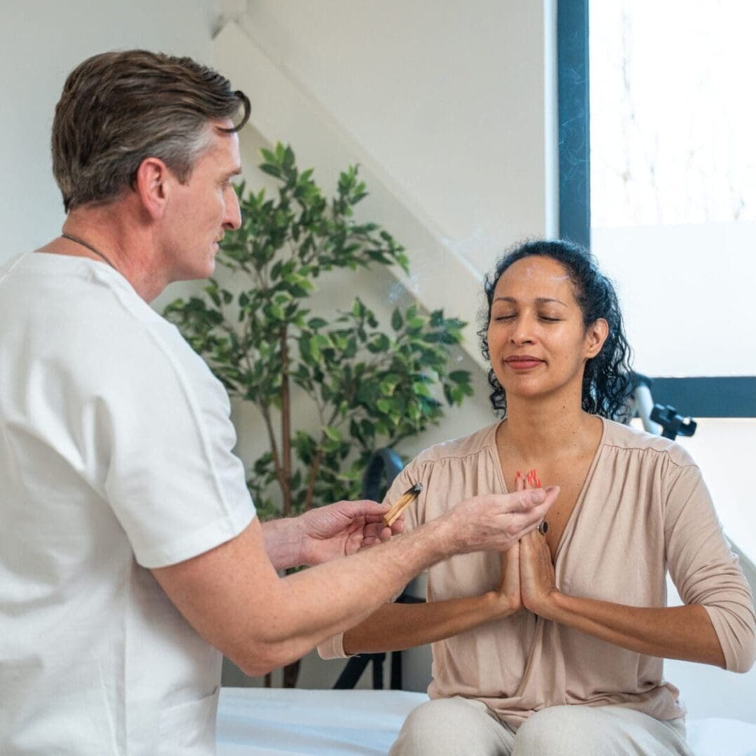 A healthcare professional discusses health with a patient in a calm setting.