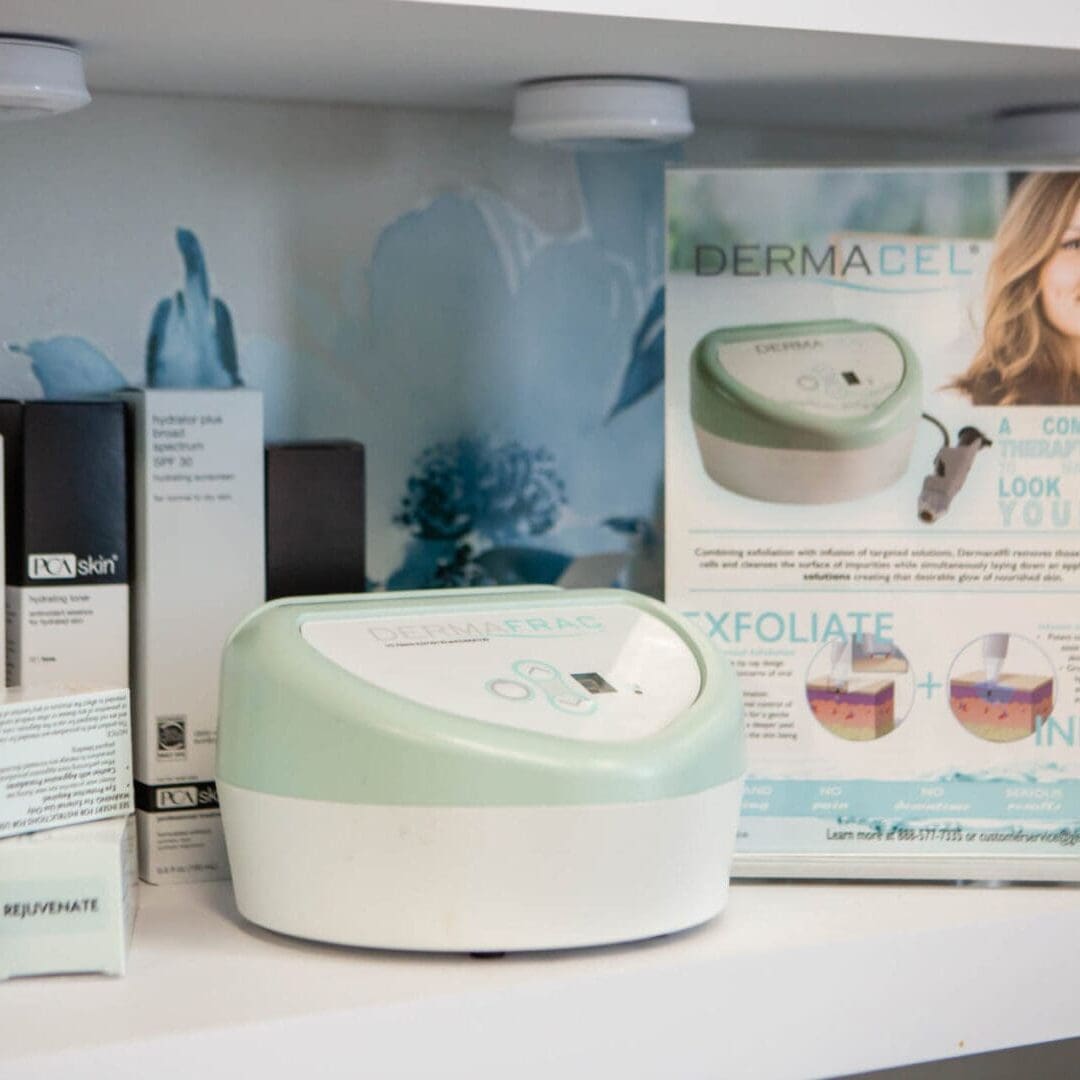 Derma Wand skin care device with packaging and accessories on display.