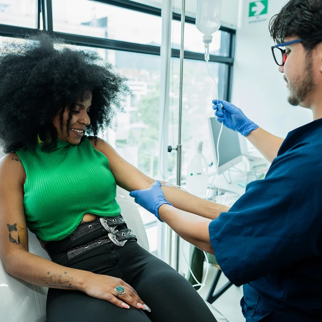 A woman receiving a vaccination from a healthcare professional.