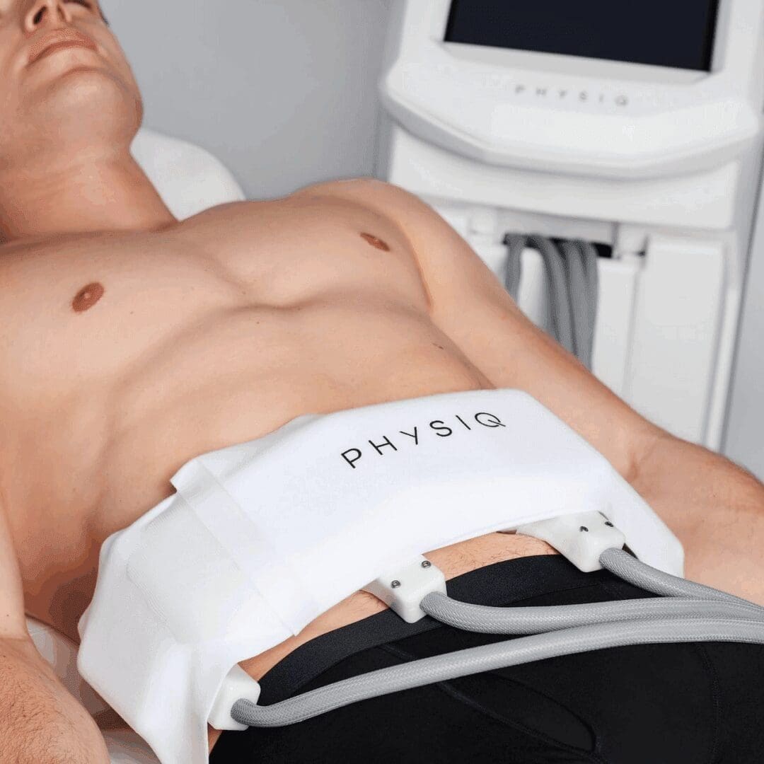 Young man undergoing a body contouring treatment with Physiq device.